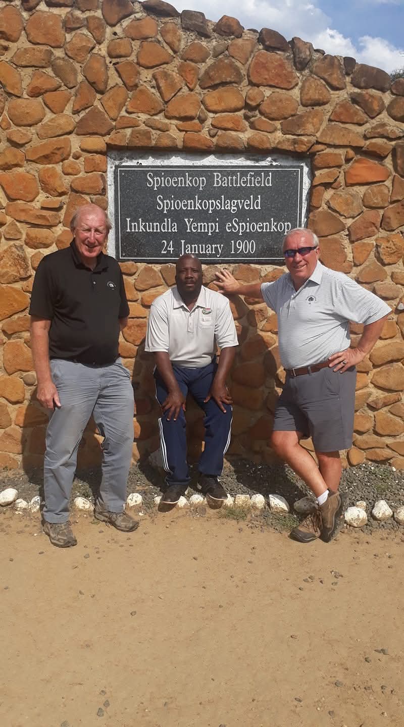 Guide and guests at Spioenkop Battlefield monument